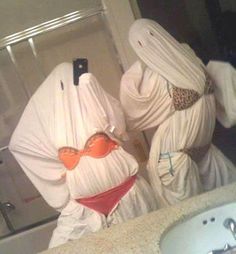 two towels shaped like women in bathing suits