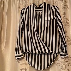 The Sexy Referee Blouse Zara Great For Spring Summer Chic And Very Jackie O Black And White Vertical Stripes Very Slimming - Size S New Without Tags Bought For Shoot Been In Storage - Circa 2011 Hits At Waist In Front Longer “Tail”In Back - Deep V Cross Over Front Super Sexy And Classy. Cotton Rayon Blend Size S Black And White Blouses, Striped Long Sleeve Party Blouse, Striped Long Sleeve Party Top, Chic Striped V-neck Blouse, Trendy Fitted Striped Blouse, Chic Striped Tops For Night Out, Elegant Striped Tops For Party, Chic V-neck Shirt For Night Out, Elegant Striped Party Tops