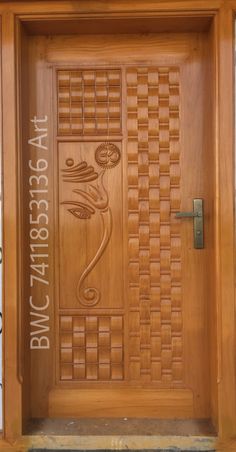 a wooden door with decorative carvings on it