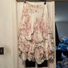 Nwot Free People Ruffle Skirt With Flowers Condition: New Without Tag Size: Medium This Fp Skirt Is Beautifully Layered With Ruffles And Detailed With Flower Images. The Skirt Itself Is On The Heavier Side But Falls Beautifully And Reflects Your Movements Well. Cheap Cotton Skirt With Ruffles, Luxury Bohemian Skirt With Floral Print, Luxury Bohemian Floral Print Skirt, Trendy Skirts Long The Little Bazaar, Cheap Tiered Ruffled Skirt, Affordable Floral Embroidered Skirt For Spring, Skirt With Flowers, Flowers Color, Free People Skirt