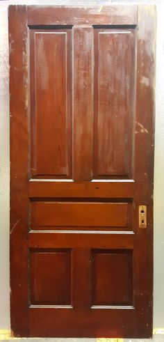 an old wooden door with no glass on it