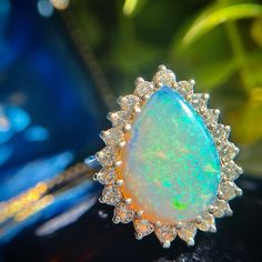 This Fine Vintage Estate Pear Opal Cocktail Ring Features A Vibrant Natural Opal Surrounded By Sparkling Natural Round Brilliant Diamonds Crafted In 14k White Gold. This Ring Is A Showstopper, Be Prepared To Be The Receiver Of Many Compliments! The 3.12 Carat Opal And 1.24 Carats Of Diamonds Equal An Impressive 4.36 Carats Total Weight. The Opal Has Incredible Spread Measuring 17.91x13.12x3.43 And The Ring Has Nearly An Inch Of Finger Coverage From Top To Bottom Making It A Sure To Be Noticed Statement Ring. Currently A Size 5.25+ Easily Sized. We Are Professional Jewelers. Prices Here Are Firm, We Do Not Trade - To Learn More About Heritage Jewelry Read Our Bio. This Ring Will Be Verified B Gia Certified Pear Shaped Fine Jewelry, Pear-shaped Opal Ring For Formal Occasions, Fine Jewelry Pear-shaped Opal Ring, Formal Pear-shaped Opal Ring, Heritage Jewellery, Diamond Cocktail Ring, Diamond Cocktail Rings, Natural Opal, Oval Cabochon