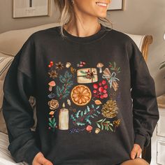 This adorable Cottage Core Aesthetic Fall/Christmas Crewneck Sweatshirt is a must have this season!  It's bright, beautiful and festive! Adult Unisex Sweatshirt Gildan 18000 *If you are interested in purchasing this shirt in a color that is not listed above, please contact me and I will see what I can do!  I have added a color chart for you to reference, but please note that all colors may not be available. *If you really love this design but would like it on a different garment (sweatshirt, tan Winter Relaxed Fit Tops As Gift, Relaxed Fit Tops For Winter Gift, Casual Christmas Sweatshirt, Casual Christmas Sweatshirt For Festive Occasion, Holiday Graphic Print Sweater For Fall, Casual Fall Festive Sweatshirt, Casual Festive Sweatshirt For Fall, Relaxed Fit Holiday Sweatshirt For Fall, Winter Crew Neck Tops As Gifts