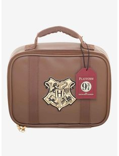 harry potter's hogwarts crest luggage bag with tag on the front and back