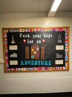 a bulletin board on the wall in a school hallway that says, pack your bags for an adventure