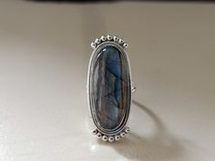 Handmade labradorite bohemian ring , you can wear this ring as a party wear ring .. Title -labradorite stone ring Stone color - blue Stone shape - oval Material - Sterling silver 925 Note - This is natural stone so shade may be little bit different .. we are giving you best quality rings on best price .. contact us for more quantity Bohemian Moonstone Ring With Large Stone For Gift, Bohemian Moonstone Ring With Large Stone As Gift, Bohemian Large Stone Moonstone Ring, Blue Bohemian Moonstone Ring, Bohemian Oval Ring With Large Stone, Bohemian Sterling Silver Cabochon Moonstone Ring, Adjustable Bohemian Crystal Ring Stamped 925, Blue Moonstone Ring With Natural Stones Bohemian Style, Blue Moonstone Ring With Natural Stones In Bohemian Style