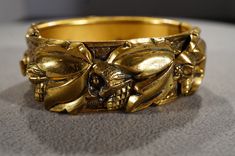 I am offering you this fabulous yellow gold tone unique classic art deco style design bangle bracelet. This is an amazing bracelet, having all of the highly sought after qualities of the ever popular art deco style era of jewelry. It is bold measuring app. 1 inches wide . Its exterior diameter is 2.5 inches. Buyer pays shipping and handling. Victorian Gold Bangle Cuff Bracelet, Yellow Gold Art Deco Bracelet, Art Deco Engraved Gold Bracelets, Art Deco Gold Engraved Bracelet, Art Deco Bangle Bracelets Collectible, Ornate Gold Bracelets For Collectors, Art Deco Gold Bracelets For Anniversary, Art Deco Gold Bracelet For Anniversary, Gold Art Deco Bracelet For Anniversary