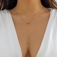 Description:Geometric Dainty Snake Chain Y NecklaceSpecification:Length: 23.6" + 2.7" extWeight: 0.24 oz/pcsMaterial: alloy metalChain Colors: Gold/SilverFeatures & Details:This minimalist snake chain y necklace is made of nickel-free. lead-free.... Trendy Metal Lariat Chain Necklace, Gold Metal Lariat Necklace For Party, Modern Gold Lariat Necklace, Modern Gold Metal Lariat Necklace, Dangle Alloy Chain Necklace For Parties, Gold-tone Alloy Necklace With Adjustable Chain, Gold Alloy Chain Necklace For Parties, Party Wear Dangle Chain Necklace In Alloy, Metal Lariat Long Necklace