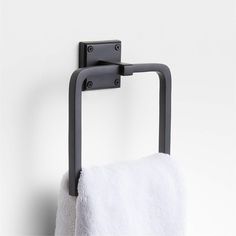 a towel rack mounted to the side of a wall