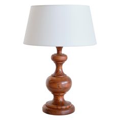 a wooden table lamp with a white shade on the top and bottom part of it