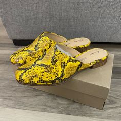 New In Box Retail $110 Heel Height .5 Inches Comfort Features: Cushion Plus Padding, Soft Leather Lining, Durable Resin Rubber Outsole Slip-On Mule Synthetic Upper Yellow Synthetic Mules With Round Toe, Yellow Flat Heel Mules For Spring, Chic Yellow Pointed Toe Mules, Yellow Closed Toe Spring Mules, Yellow Flat Mules For Spring, Trendy Yellow Mules For Spring, Yellow Flat Casual Mules, Yellow Synthetic Slip-on Heels, Yellow Casual Mules For Spring