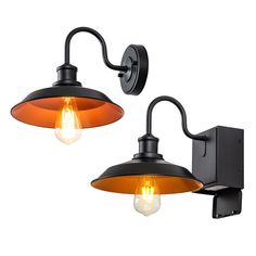 two lights that are on the side of a wall mounted light with an orange glass shade