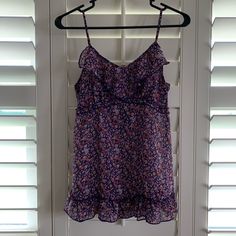 Brand New, Never Used, Excellent Condition! Adjustable Strap Blouse With Elastic Back For A Perfect Fit. Perfect Summer Top! Household Has No Pets And No Smokers. Purple Floral Print Summer Top, Summer Floral Print Purple Tops, Summer Purple Floral Print Top, Casual Purple Tank Top With Floral Print, Purple Camisole Top For Beach, Purple Floral Print Summer Tank Top, Summer Purple Floral Print Tank Top, Casual Purple Camisole Top, Purple Cami Tank Top For Beach