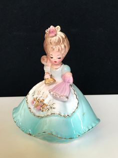 "Rare Vintage Josef Originals Figurine girl in a turquoise dress holding a gold iton, ironing a small pink dress.  So adorable! Beautiful detail no repairs. 4\" tall." Small Pink Dress, Josef Originals, Turquoise Dress, Original Music, So Adorable, Collectible Figurines, Pink Dress, Art Collection, Figurines