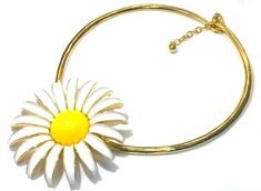 This very pretty large Kenneth Jay Lane hinged collar necklace features a large daisy flower finished in yellow and white enamel.  The necklace chain is a curved bar style (approx. .20" W) and is approx. 5" dia. when closed and opens wide, for most neck sizes and has a 2" extender and a lobster claw clasp.   The flower itself measures 2.75" dia. Very unusual and pretty and is in very good/excellent condition, no wear.   Signed Kenneth(c)Lane and made in USA.  The necklace weighs 85 grams Shippin Retro White Flower Jewelry, Large Daisy, Flower Collar, Curved Bar, Bar Styling, Wedding Jewellery Necklace, Kenneth Jay Lane, White Enamel, Necklace Chain