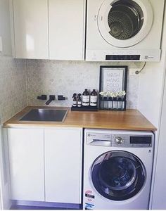 a washer and dryer in a small kitchen