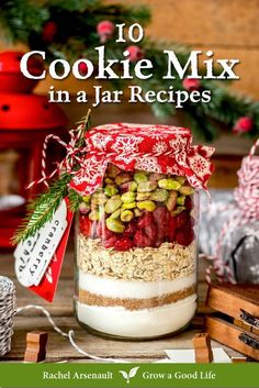 a jar filled with granola and nuts on top of a table next to christmas decorations