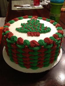 a decorated cake sitting on top of a wooden table