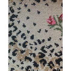 a rug with black and pink flowers on it