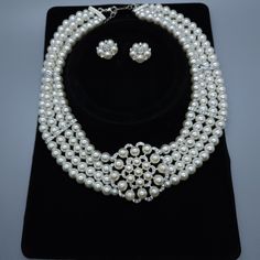 Pearl & Rhinestone Necklace Brand New This Is A Beautiful Set 4 Strand Fake Pearl Necklace Rhinestone Accents Big Flower In Center Flower Earrings Surgical Steel Posts Lobster Claw Clasp Adjustable Silver Plated White Rhinestone Round Jewelry, White Rhinestone Jewelry For Jewelry Making, White Rhinestone Round Necklace For Party, White Round Rhinestone Necklace For Party, White Crystal Rhinestone Necklace In Costume Jewelry Style, White Rhinestone Necklace For Party, White Crystal Rhinestone Costume Jewelry Necklace, White Crystal Rhinestone Costume Necklace, White Pearl Jewelry With Rhinestones