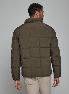 A nylon quilted puffer jacket crafted with recycled fiber insulation fill providing maximum warmth. Features front flap pocket, interior pocket, and hidden phone pocket. Snap closure on cuffs and side vents for comfort. Throw over your favorite flannel for that next-level-cozy feeling. Details Models is 6'1" and wear a size medium. Machine wash cold with similar colors, do not bleach, tumble dry low, do not iron, do not dry clean. 100% Nylon Brown Down Puffer Jacket With Padded Collar, Solid Down Outerwear With Padded Collar, Khaki Nylon Puffer Outerwear, Khaki Puffer Jacket With Pockets For Cold Weather, Outdoor Down Outerwear With Padded Collar, Solid Color Quilted Puffer Jacket, Green Down Puffer Jacket With Padded Collar, Outdoor Down Outerwear With Pockets, Functional Quilted Jacket With Padded Collar For Fall