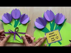 mother's day card with flowers made from paper and purple ribbon tied around it