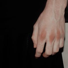 a close up of a person's hand holding something