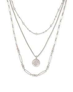 Pre-layered for you by this design team, the Medallion Coin Triple Strand Necklace in Gold combines this iconic custom medallion with a trio of metallic chains. Medallion Necklace, Multi Strand Necklace, Brass Metal, Strand Necklace, Multi Strand, Kendra Scott, Layered Necklaces, Vintage Gold, Silver Necklaces