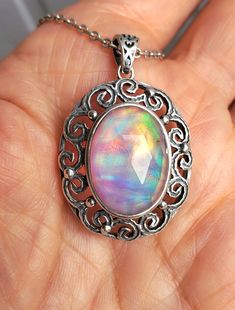 Beautiful Aurora Opal Necklace, 13x18mm Lab Created Synthetic Rose Cut Doublet Opal, Watch Whole Video as Colors Change With Lighting And Change With Every Turn! Antiqued Sterling Silver Pendant, 20" Antiqued Sterling Chain. Chain Length Options Available By Messaging Seller At Time Of Purchase. Gift Box Included. *This Gem Is Slightly More Pastel Than Our Other Similar Listing See Videos, Opal Necklace, Rose Cut, Chain Lengths, Aurora, Sterling Silver Pendants, Color Change, Gift Box, Opal