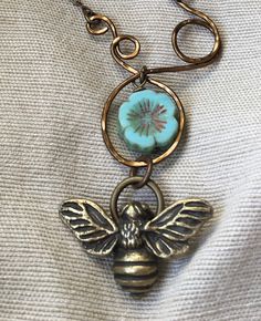 Such a cute little bee! The charm is from Green Girl Studios. It is cast from solid pewter and has a natural brass finish. I looped the brass wire and hammered it, making a whimsical setting for the Czech glass flower and then hung the bee under it. The chain is high quality natural brass by Vintaj and has an adjustable extender. The necklace measures 20 inches total. I mail my necklaces secured on a hand stamped mat board card. I wrap them in colorful tissue and put them in a bubble envelope fo Accessories Bags Shoes, Green Girl, Bee Necklace, Spring Jewelry, Bubble Envelopes, Summer Jewelry, Honey Bee, Flower Necklace, Czech Glass