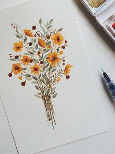 a watercolor painting of yellow flowers on white paper next to markers and paintbrushes