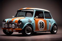 an orange and blue mini car with numbers on it's front end, sitting in a dark room