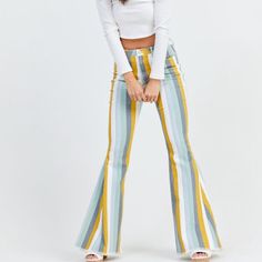 The Electra Flare Jeans Are A Statement Piece This Season! With Exaggerated Flare Detailing And A Destroyed Hem, These Jeans Are Perfect Paired With Your Favorite Sweater Or Graphic Tee! Size: L Fit: High Rise, Fitted Thighs, Flare Bottom Closure: Button And Zipper Front Imported Retro Multicolor Spring Jeans, Retro Multicolor Summer Jeans, Multicolor Retro Spring Jeans, Trendy Yellow Summer Jeans, Fitted Yellow Cotton Jeans, Fitted Yellow Jeans For Summer, Yellow Jeans For Spring, Summer Striped Fitted Jeans, Striped Denim