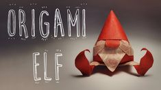 an origami elf sitting on top of a piece of paper with the words, origam elf