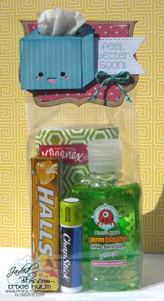 a bottle of hand sanitizer next to some other items