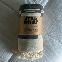 a roll of sand sitting on top of a bed