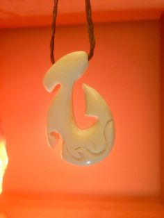 This is a hand carved bone pendant in fishhook Hawaiian style. Polished with bone beads to finish Diamonds In The Rough, Jewellery Diamonds, Bone Pendant, Carved Bone, Bone Carving, Bone Beads, Hawaiian Style, Rough Diamond, Fine Jewellery