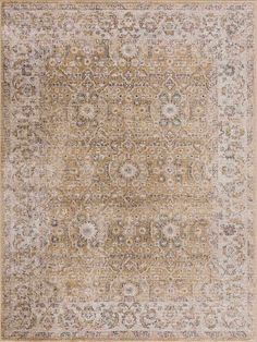 an antique rug with many different colors and patterns on the carpet, including beiges