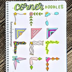 a spiral notebook with some stickers on it and the words corner doodles written in green