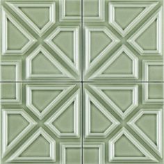 some green tiles with white squares and lines on them, all in the same pattern