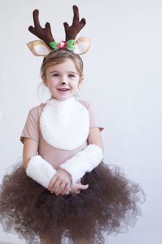 An adorable deer costume, perfect for play, Halloween or even Christmas celebrations complete with a cute antler crown that truly makes your little one the king or queen of their backyard domain.   The headband is adorned with sweet little felt ears, antlers and a holly bunch. The outfit is complete with a fluffy bib as well as leg and arm warmers to get that furry woodland look and a cute tutu. Finish this outfit off with a complimentary top from home!   * The costume does not include a shirt. Reindeer Costume Kids, Rudolph Costume, Fawn Headband, Fawn Costume, Antler Crown, Deer Headband, Reindeer Costume, Hand Painted Pillows, Fairytale Forest