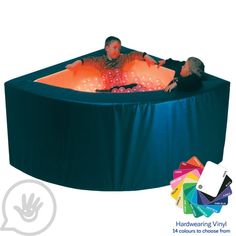 two people sitting in an inflatable pool with color swatches