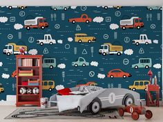 a child's room with cars and trucks on the wall, including a toy car