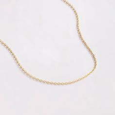 "We must say: Simple is always better and always unique. Cherish yourselves with our 14k gold cable chain necklace. After all, what is better than a minimalist necklace that goes with everything? D E T A I L S * Made to Order. * 100% 14k Solid Gold * Choice of Gold Color: Yellow Gold, White Gold * Chain Thickness : 1 mm / 0.03 inch * Length: 14\", 16\", 18\", 20\", 22\" (Got a little note that can help you in the photos.) * Ready to Ship in 1-3 Business Days * 100% US sourced * 2 Years Warranty Sterling Silver Cable Chain Necklace In Yellow Gold, Yellow Gold Sterling Silver Cable Chain Necklace, Gold Sterling Silver Cable Chain Necklace, Minimalist Sterling Silver Necklace With Gold Chain, Gold Sterling Silver Necklaces With Rolo Chain, Minimalist Yellow Gold Necklace With Cable Chain, 14k Gold Rolo Chain Necklace Gift, Minimalist Link Chain Necklace For Anniversary, Dainty Cable Chain Necklace For Anniversary