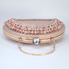 New to our Millennium collection, This beautiful romantic Half Moon Rhinestones bridal clutch bag is made of very fine quality Polyester Fabric, metal, Rhinestone and it comes with a 45 inch long Detachable chain for your Big day! Measurements- the clutch is 5 inches Height, 9 inches length and 2.5 inches in width ► ABOUT YOUR ORDER * All items are neatly packaged in our beautiful jewelry boxes and elegant organza bags. * All items are 100% gift-ready. * Each order comes with a personalized handwritten card and a branded Millennium Bride jewelry cloth. * Each order comes with a free gift. ► PERSONALIZTION * If your order is a gift, you may contact us with the recipient's name or a message, and we'll print a personalized card that will be elegantly packaged with your order. We'll also perso Rhinestone Evening Bag For Wedding, Wedding Evening Bag With Rhinestones, Stone Embellished Clutch For Events, Elegant Embellished Pink Clutch, Elegant Pink Embellished Evening Bag, Elegant Pink Embellished Clutch, Pink Crystal Embellished Evening Bag For Formal Occasions, Pink Crystal Embellished Evening Bag For Formal Events, Evening Bridal Accessories With Rhinestones