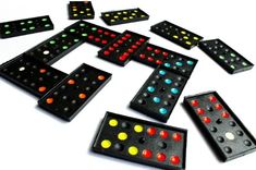 a group of black and red dominos sitting on top of each other next to one another