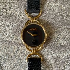 Authentic Gucci Watch With Black Leather Band. Works Perfectly And I Just Put In A Brand New Battery On 1/25/2022. In Excellent Condition. Crystal Has 2 Tiny Inclusions. Band Is In Excellent Condition. Luxury Gucci Watch For Formal Occasions, Gucci Designer Watches For Business, Timeless Gucci Watches For Formal Occasions, Gucci Gold Jewelry With Diamond Hour Markers, Gucci Yellow Gold Watch For Formal Occasions, Designer Gucci Watch For Evening, Designer Gucci Watches For Business, Yellow Gold Gucci Watch For Formal Occasions, Gucci Timeless Watch Women