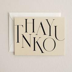 a card with the words thau inko written in cursive black on it