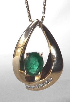 Stunning 14k Gold 1.37Ct Genuine Emerald Diamond Slide Pendant Vibrant Color Stunning 14k Gold 1.37Ct Genuine Emerald Diamond Teardrop Slide Pendant Large 1" Click images to enlarge Description   Offered today is one of the nicest emerald pendants I've ever had the pleasure to offer here on ebay.  This is an exceptional quality piece with a gorgeous, vibrant green emerald.  It is a great size to be noticed, at a full one-inch long.  PHOTOS DO NOT DO IT JUSTICE--I don't think you'll be disappointed. This slide pendant (it does not have a dedicated bail--you just slide your chain through it) is done in a modified teardrop shape, with the two sides curving around, and the emerald nestled in the center between them.   This large emerald is earth mined and genuine.  You can see some inclusions Emerald Pendant, Natural Emerald, Emerald Diamond, Fine Jewellery Necklace, Emerald, Jewelry Watches, Jewelry Necklace Pendant, Fine Jewelry, Jewelry Necklaces