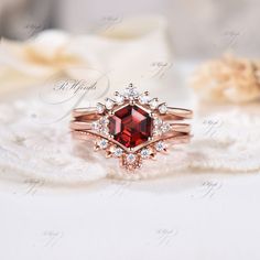 Garnet Wedding Ring, Garnet Jewelry, Birthday Gift For Women, Ring For Mother, Elegant Ring, Unique Ring, Anniversary Gift For Her Product Detail Main Ring Material: 925 Sterling Silver, 10k/14k/18k Solid Rose/White/Yellow Gold Center Stone: 6x6mm Hexagon Cut Natural Garnet Side Stones: Round Cut Moissanites Wedding Band 1 Material: 925 Sterling Silver, 10k/14k/18k Solid Rose/White/Yellow Gold Gemstones: Round Cut Moissanites Wedding Band 2 Material: 925 Sterling Silver, 10k/14k/18k Solid Rose/W Wedding Rings With Round Cut Garnet, Ruby Crystal Wedding Ring With Open Shape, Red Octagon Wedding Rings, Elegant Round Garnet Crystal Ring, Octagon Ruby Ring For Wedding, Fine Jewelry, Garnet Wedding Rings, Garnet Wedding, Garnet Engagement Ring, Curved Wedding Band